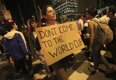 528733-a-demonstrator-holds-a-sign-during-one-of-the-many-protests-around-brazil-s-major-cities-in-sao-paul